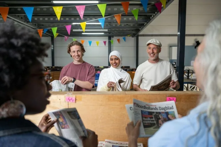 Content image krantenbezorgers op het depot